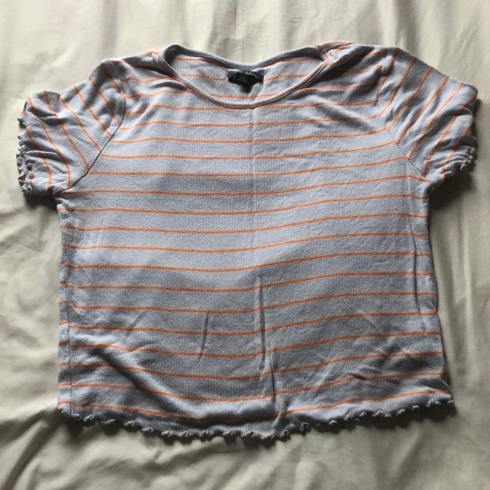 Light blue shirt with orange stripes